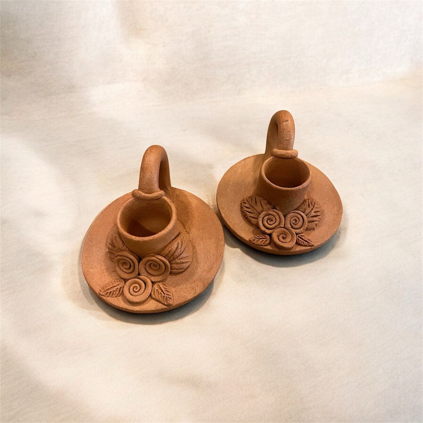Terracotta candle stand.