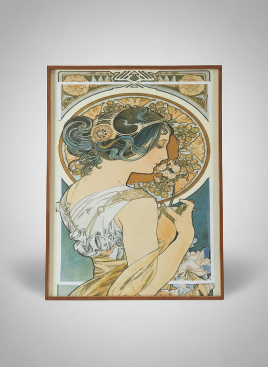 Framed Art Nouveau-style poster on a wall.