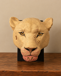 Ceramic Lion And Lioness Head Sculptures On A Wooden Stand (Each)