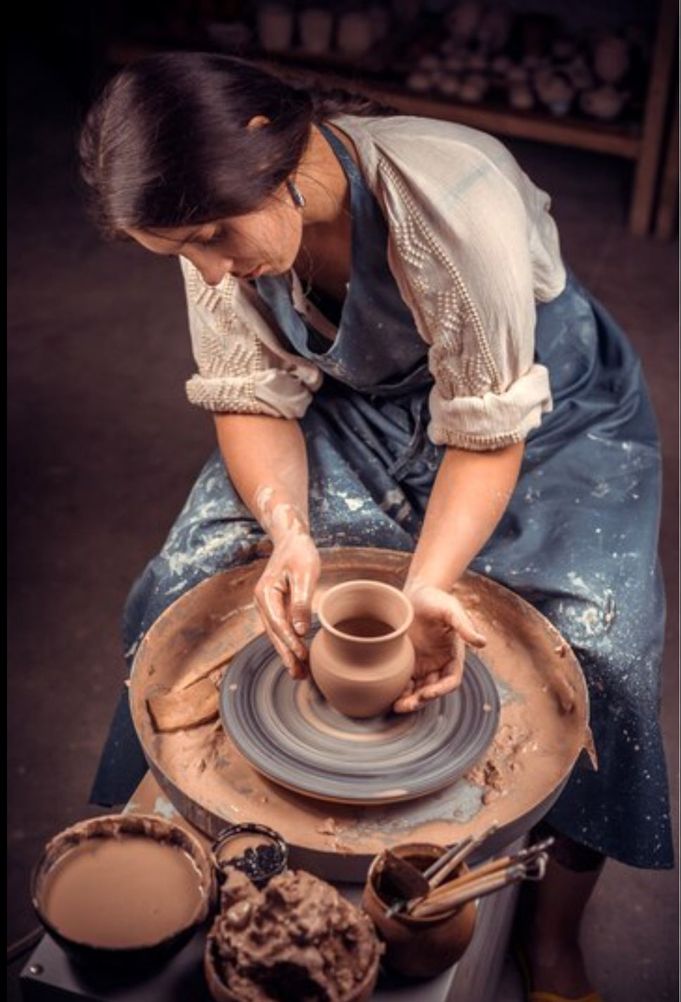 Terracotta pottery being crafted by hand