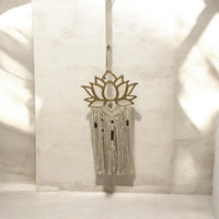 Gold lotus macrame wall hanging.