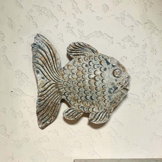 Ceramic fish wall art.