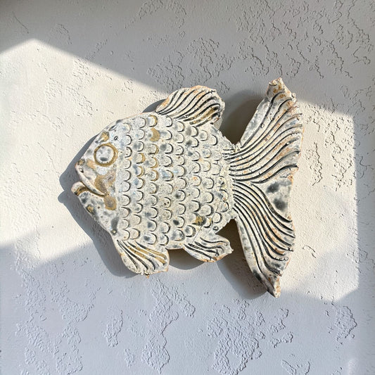 Ceramic fish wall art.