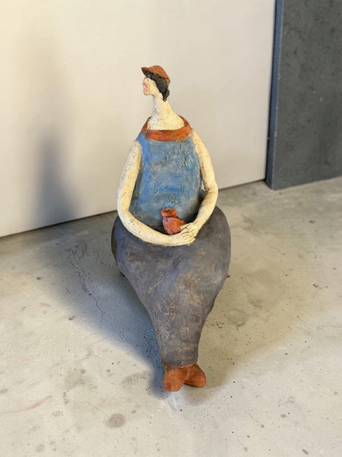 Ceramic girl with red hat